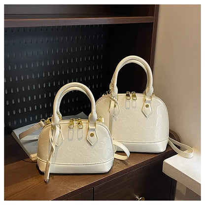 2025 Designer Hottest Shell Fashion Versatile Glossy High Quality Women Shoulder Crossbody Bag Available in Red Black and More