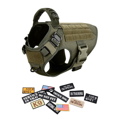 Tactical dog harness in olive green with multiple label patches, adjustable straps, sturdy handle, and assorted service dog badges displayed below.